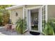 Cozy bedroom with French doors opening to an outdoor brick patio area, combining indoor and outdoor living seamlessly at 640 N Osprey Ave, Sarasota, FL 34236