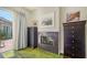 Bedroom with a fireplace, a glass door leading to the exterior patio, and dark dressers at 640 N Osprey Ave, Sarasota, FL 34236