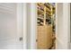Walk in closet with drawers and shelves for organized storage at 640 N Osprey Ave, Sarasota, FL 34236
