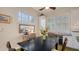 Dining room with a dark wood table, seating for six, and plenty of natural light from the shuttered windows at 640 N Osprey Ave, Sarasota, FL 34236