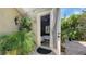 Charming courtyard entry with tropical plants leading to an inviting doorway at 640 N Osprey Ave, Sarasota, FL 34236