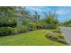 Inviting home featuring lush landscaping, well manicured lawn, and a lovely sidewalk at 640 N Osprey Ave, Sarasota, FL 34236