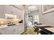 Modern kitchen with stainless steel refrigerator, light countertops, and white cabinets at 640 N Osprey Ave, Sarasota, FL 34236