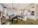 Open kitchen with stainless appliances, eat-in island, and plenty of cabinet space at 640 N Osprey Ave, Sarasota, FL 34236