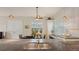 Kitchen island with stainless steel sink and faucet, open floor plan to living and dining area at 640 N Osprey Ave, Sarasota, FL 34236