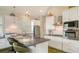 Bright kitchen featuring a large island, stainless steel appliances and modern fixtures at 640 N Osprey Ave, Sarasota, FL 34236