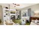 Comfortable living area featuring a fireplace, a built-in entertainment center, and access to the patio at 640 N Osprey Ave, Sarasota, FL 34236