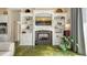 Living area features a fireplace, built-in shelves, and open access, creating a cozy atmosphere at 640 N Osprey Ave, Sarasota, FL 34236