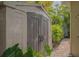 Backyard shed with double doors and brick pathway at 640 N Osprey Ave, Sarasota, FL 34236