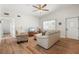 Comfortable living room with ceiling fan, wood floors, and plenty of natural light at 6715 Georgia Ave, Bradenton, FL 34207