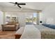 Spacious main bedroom with a seating area, wood floors, and plenty of natural light at 6715 Georgia Ave, Bradenton, FL 34207