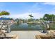 Beautiful waterfront view showcasing a private canal, boat lift, and serene waterside living at 6715 Georgia Ave, Bradenton, FL 34207