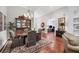 Cozy dining room with hardwood floors, a china cabinet, and view to other rooms at 7253 Orchid Island Pl, Bradenton, FL 34202