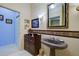 Charming bathroom vanity with unique sink and decorative backsplash at 7340 Villa D Este Drive, Sarasota, FL 34238