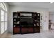 A large entertainment center is featured in the home, offering both display and storage space at 7340 Villa D Este Drive, Sarasota, FL 34238