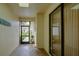 Foyer with tiled floors, an open entry way, and view to the front garden at 7340 Villa D Este Drive, Sarasota, FL 34238