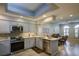 Updated kitchen with stainless steel appliances, skylight, and open concept to the living area at 7340 Villa D Este Drive, Sarasota, FL 34238