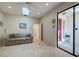Comfortable living room with skylight, neutral tones, and lots of natural light at 7340 Villa D Este Drive, Sarasota, FL 34238