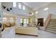 Spacious living room with high ceilings, large windows, and tile flooring at 7340 Villa D Este Drive, Sarasota, FL 34238