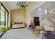 Open living room with high ceilings, elegant chandelier, and large windows allowing for natural light at 7340 Villa D Este Drive, Sarasota, FL 34238