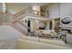 Inviting living room with a large staircase, neutral decor, and an open layout at 7340 Villa D Este Drive, Sarasota, FL 34238
