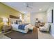 Bright main bedroom features a ceiling fan, a decorative headboard, and calming colors at 7340 Villa D Este Drive, Sarasota, FL 34238