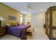 Spacious main bedroom with a ceiling fan, tile floors, walk in closet and en-suite bathroom at 7340 Villa D Este Drive, Sarasota, FL 34238