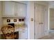 Bright office nook featuring custom cabinets, granite countertops, and storage space at 7340 Villa D Este Drive, Sarasota, FL 34238