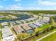 Aerial view of a beautiful single-Gathering home, showcasing a screened-in pool and lush landscaping in a gated community at 8163 Redonda Loop, Lakewood Ranch, FL 34202
