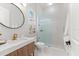 Contemporary bathroom with marble sink and vanity, modern shower with glass enclosure, and stylish fixtures at 8163 Redonda Loop, Lakewood Ranch, FL 34202