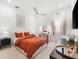 Bright bedroom offers modern decor, ceiling fan, luxury flooring, and natural light at 8163 Redonda Loop, Lakewood Ranch, FL 34202