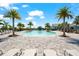 Expansive community pool area with inviting lounge chairs set among palm trees for a resort-style experience at 8163 Redonda Loop, Lakewood Ranch, FL 34202