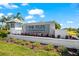 The Isles at Lakewood Ranch community entrance sign surrounded by colorful flowers and lush greenery at 8163 Redonda Loop, Lakewood Ranch, FL 34202