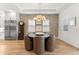 Elegant dining area with a round table, stylish chairs, and a stone accent wall, perfect for gatherings at 8163 Redonda Loop, Lakewood Ranch, FL 34202