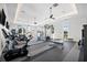 Bright fitness center with modern equipment, large windows, and ceiling fans for a comfortable workout environment at 8163 Redonda Loop, Lakewood Ranch, FL 34202