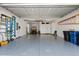 Spacious two car garage has epoxy floors and white custom storage cabinets at 8163 Redonda Loop, Lakewood Ranch, FL 34202
