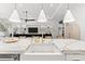 Modern kitchen island featuring marble countertops and pendant lighting at 8163 Redonda Loop, Lakewood Ranch, FL 34202