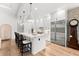 Bright kitchen features a marble island with seating, stainless steel appliances, and pendant lighting at 8163 Redonda Loop, Lakewood Ranch, FL 34202