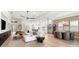 Open-concept living space with modern decor, a dining area, and abundant natural light, ideal for entertaining at 8163 Redonda Loop, Lakewood Ranch, FL 34202