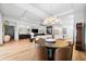 Open concept living area featuring a dining table, stylish chandelier, and built in shelving at 8163 Redonda Loop, Lakewood Ranch, FL 34202