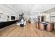 Modern living space with hardwood floors and a view of the kitchen and dining area at 8163 Redonda Loop, Lakewood Ranch, FL 34202