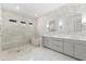 Luxurious bathroom features a stand up shower, bathtub, and vanity with grey cabinets at 8163 Redonda Loop, Lakewood Ranch, FL 34202
