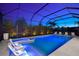 The inground pool features an attached spa and several outdoor lounge chairs for relaxation at 8163 Redonda Loop, Lakewood Ranch, FL 34202