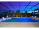 Beautiful outdoor pool with lounge seating and landscape lighting perfect for relaxation at 8163 Redonda Loop, Lakewood Ranch, FL 34202