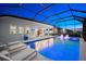 The pool and lounge area showcases the perfect spot for relaxation and entertainment at dusk at 8163 Redonda Loop, Lakewood Ranch, FL 34202