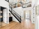 A bright staircase leads up to a loft, and a powder room is also visible at 8163 Redonda Loop, Lakewood Ranch, FL 34202