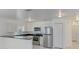 Modern kitchen featuring stainless steel appliances and white cabinetry at 838 31St E Ave, Bradenton, FL 34208
