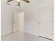 Bright bedroom featuring neutral walls, tiled floors, a ceiling fan, and a closet for ample storage at 842 31St E Ave, Bradenton, FL 34208
