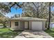 Charming single-story home with a well-maintained lawn and attached one-car garage at 842 31St E Ave, Bradenton, FL 34208