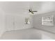 Bright main bedroom featuring neutral paint, a ceiling fan, and tile flooring throughout at 842 31St E Ave, Bradenton, FL 34208